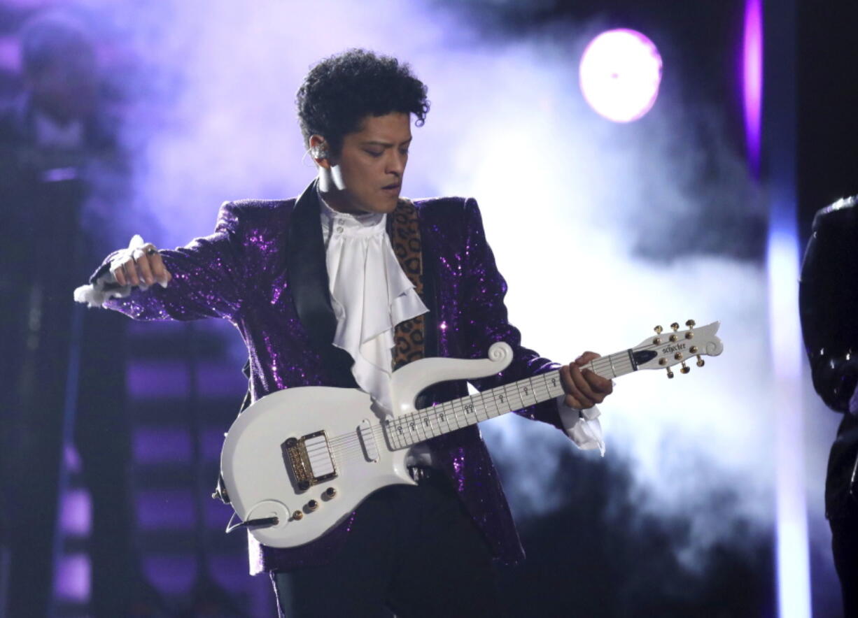 Bruno Mars performs &quot;Let&#039;s Go Crazy&quot; during a tribute to Prince at the 59th annual Grammy Awards on Feb. 12 in Los Angeles.