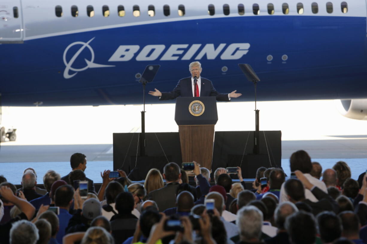 President Donald Trump speaks to Boeing employees Friday in the final assembly building at Boeing South Carolina in North Charleston, S.C. The president visited the plant where Boeing rolled out the first 787-10 Dreamliner aircraft from its assembly line seen in back.