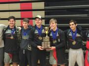 The Union wrestling team celebrates its 4A GSHL District team title on Saturday at Camas High School.