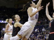 Washington&#039;s Kelsey Plum drives the lane to score against Utah and tie the all-time career scoring record in the second half of an NCAA college basketball game Saturday, Feb. 25, 2017, in Seattle. Washington won 84-77.