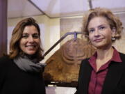 Barbara Jatta, left, director of the Vatican Museums, and Alessandra Di Castro, director of Rome&#039;s Jewish Museum, stand in front of a bas relief showing a menorah at the end of a Monday press conference in Rome.