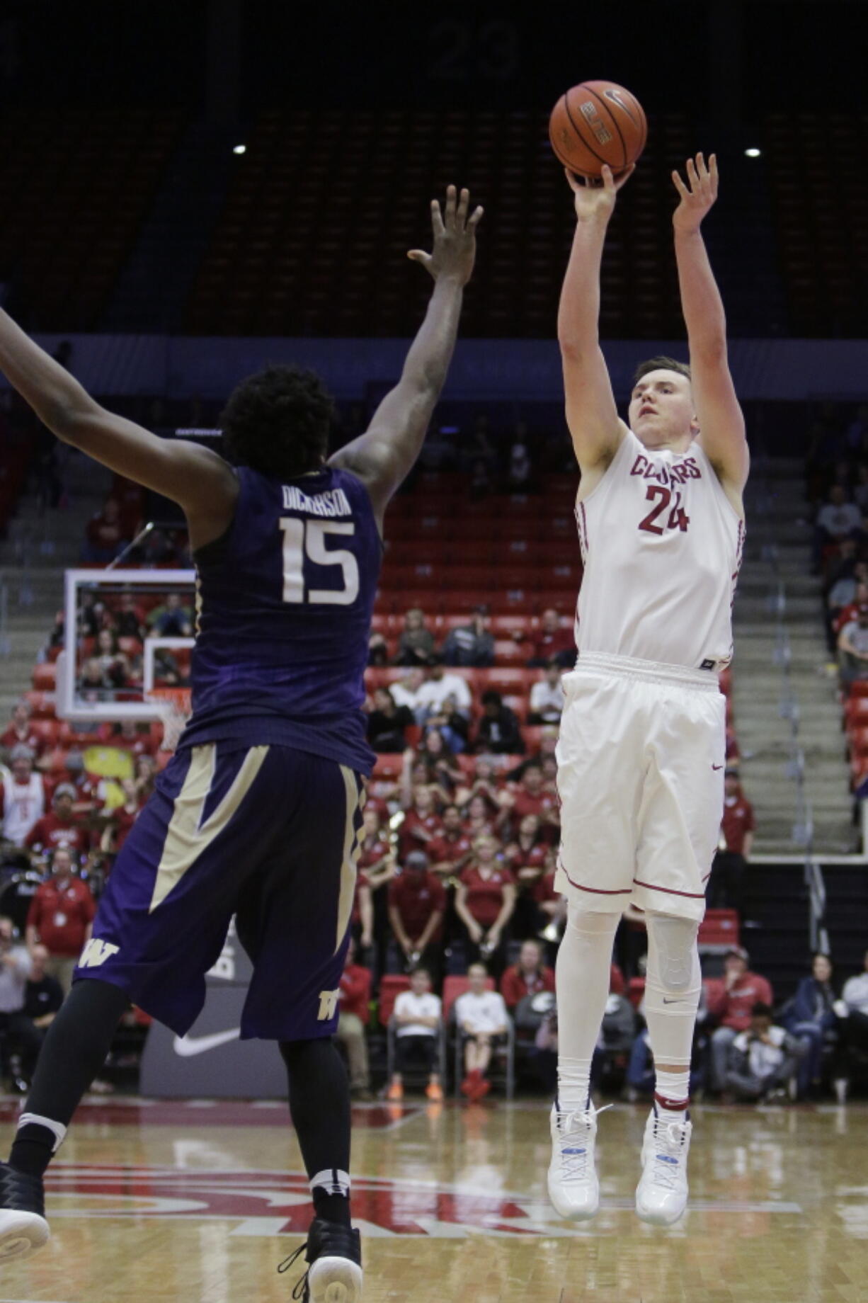 Washington State forward Josh Hawkinson (24) shoots against Washington forward Noah Dickerson (15) during the second half of an NCAA college basketball game in Pullman, Wash., Sunday, Feb. 26, 2017. Washington State won 79-71.