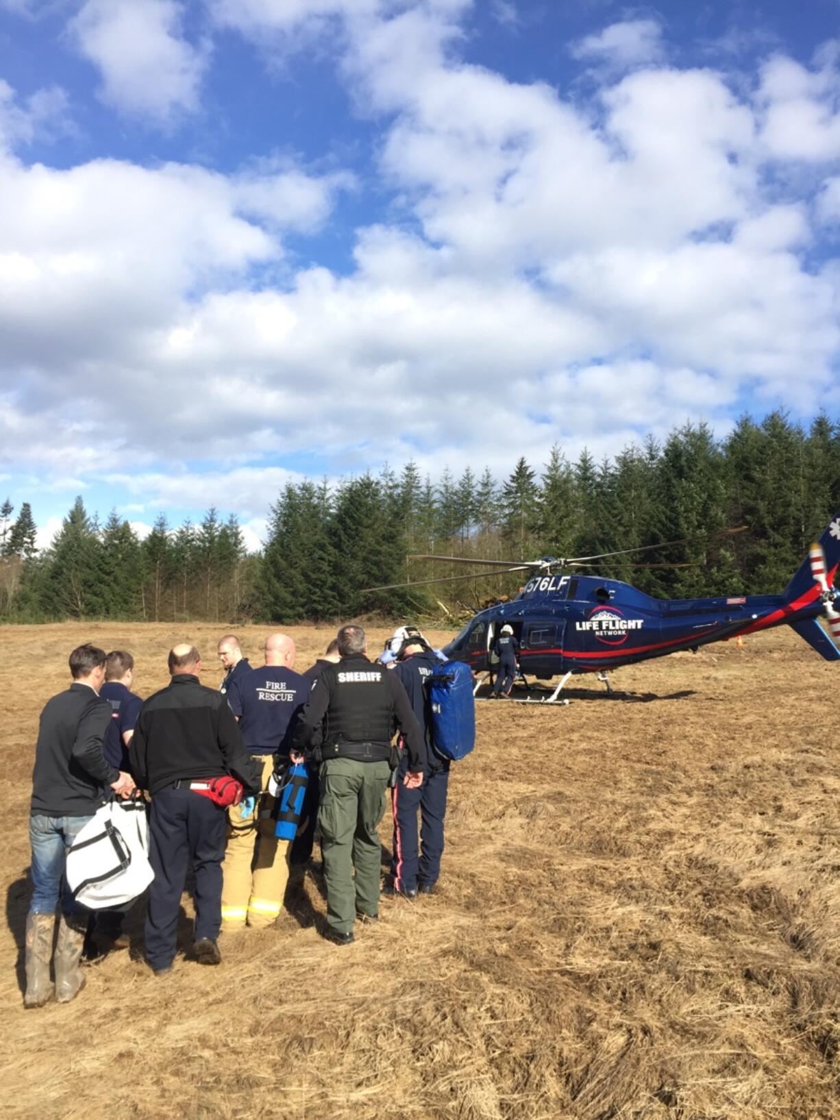 Emergency responders load a burned boy into a LifeFlight helicopter Saturday afternoon.