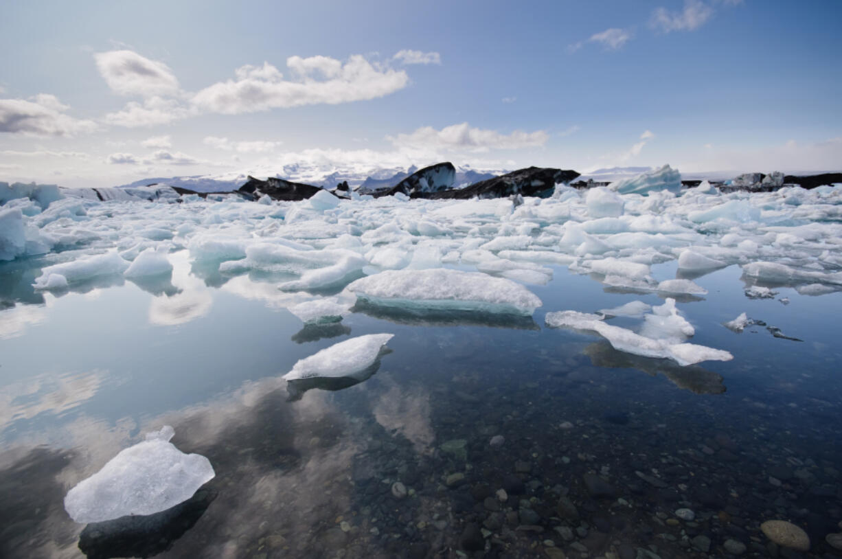 Icebergs melt in the north Atlantic sea.