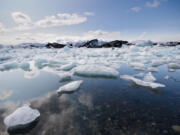 Icebergs melt in the north Atlantic sea.