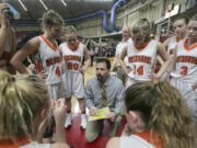 Washougal head coach Brian Oberg talks with his team during the first round of the WIAA 2A girls state tournament on Wednesday, Mar. 1, 2017, at the Yakima Valley SunDome.