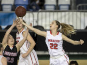 Above, Camas&#039; Madison Freemon (22) goes for a rebound against Sunnyside&#039;s Lexi Skyles. Below, Camas&#039;  Teague Schroeder, right, gets into a jump-ball situation with Sunnyside&#039;s Morgan Dulm.