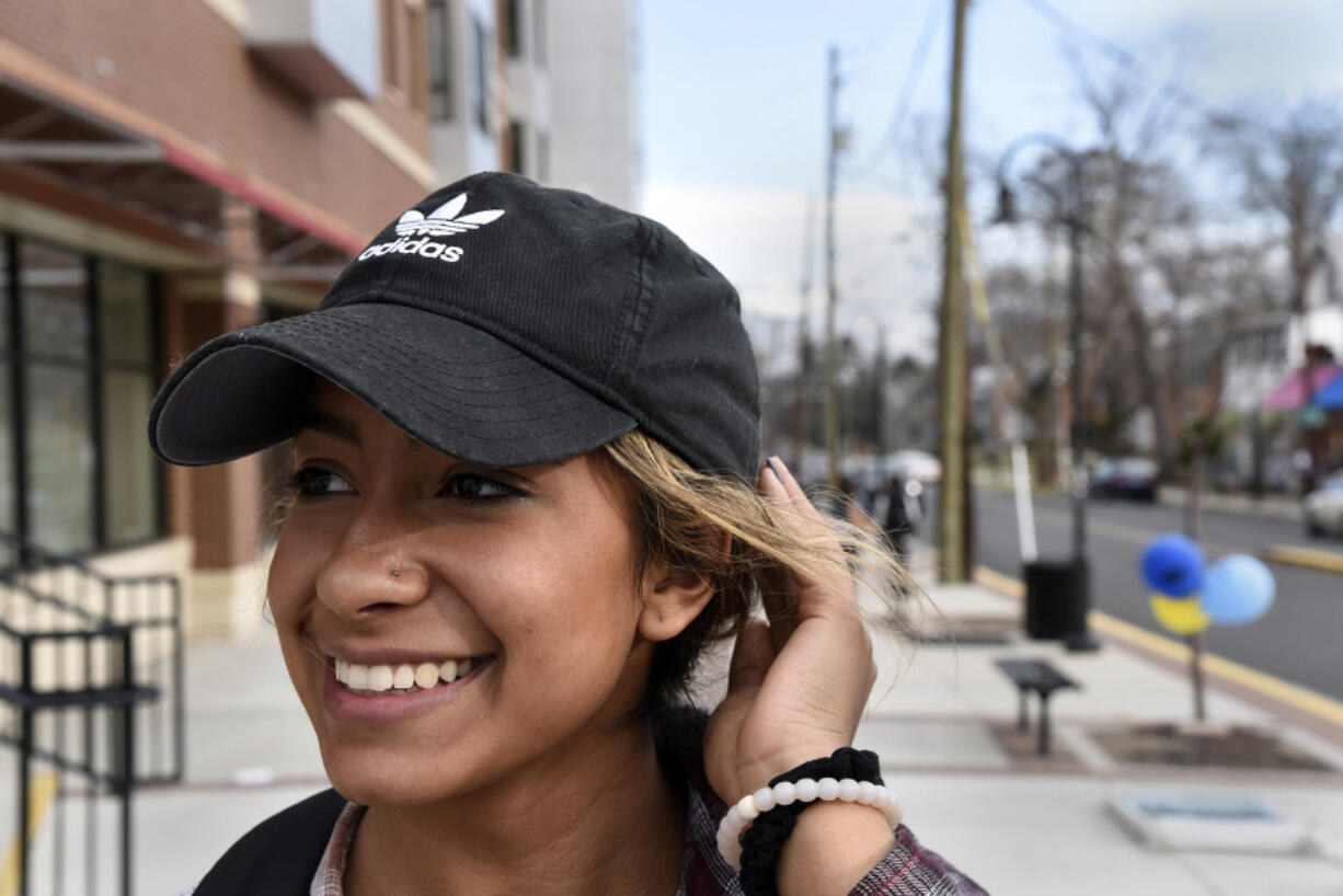 Keli Reyes, a University of Maryland sophomore, wears an Adidas cap in College Park, Md.