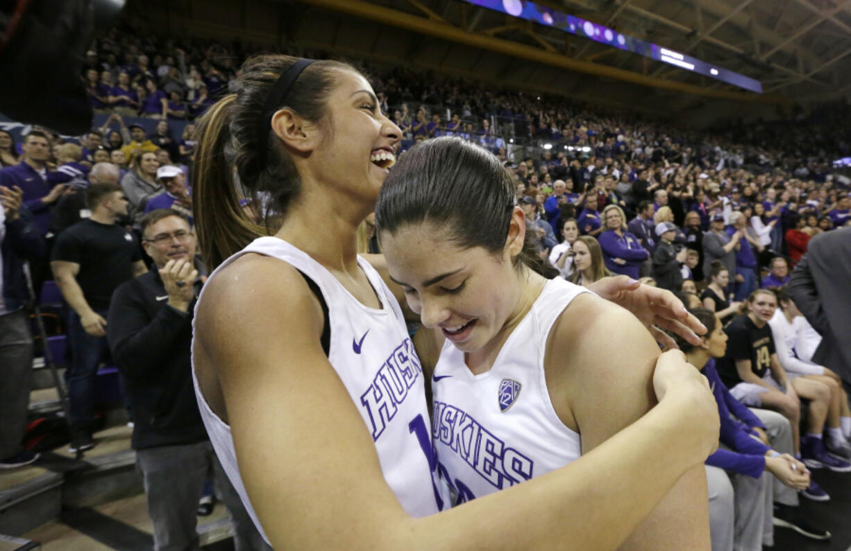 Washington&#039;s Kelsey Plum, right, is greeted by Heather Corral, a Prairie High grad, after Plum set the new all-time career NCAA scoring record of 3,397 points on Feb.