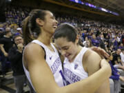 Washington&#039;s Kelsey Plum, right, is greeted by Heather Corral, a Prairie High grad, after Plum set the new all-time career NCAA scoring record of 3,397 points on Feb.