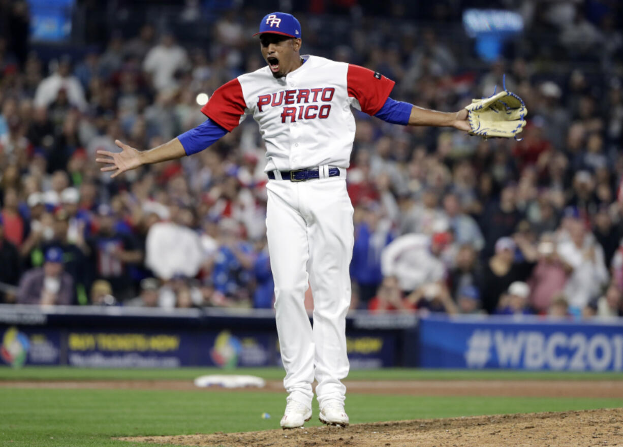 Puerto Rico pitcher Edwin Diaz reacts after getting the last out to defeat the Dominican Republic in a second-round World Baseball Classic game Tuesday, March 14, 2017, in San Diego. Puerto Rico won, 3-1.