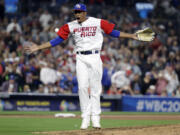 Puerto Rico pitcher Edwin Diaz reacts after getting the last out to defeat the Dominican Republic in a second-round World Baseball Classic game Tuesday, March 14, 2017, in San Diego. Puerto Rico won, 3-1.