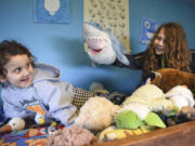 Felix Duncan, 11, right, plays with his younger sister, Esme, 3, in Felix&#039;s bunk bed filled with stuffed animals from his many hospital stays. The Hazel Dell boy was diagnosed with leukemia when he was 22 months old and, through the nonprofit Candlelighters for Children with Cancer, received several stuffed animals throughout his 3 1/2  years of treatment.