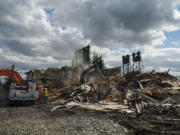 Crews demolish the hotel portion of the Red Lion Hotel Vancouver at the Quay on Thursday afternoon.