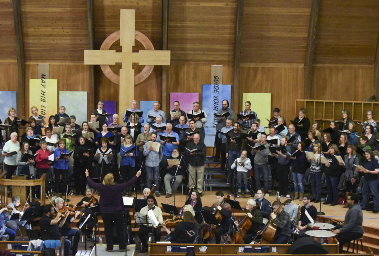 Vancouver USA Singers rehearse with a full orchestra March 6 for their upcoming performances of Mozart and Mollicone at the First Presbyterian Church in Vancouver.