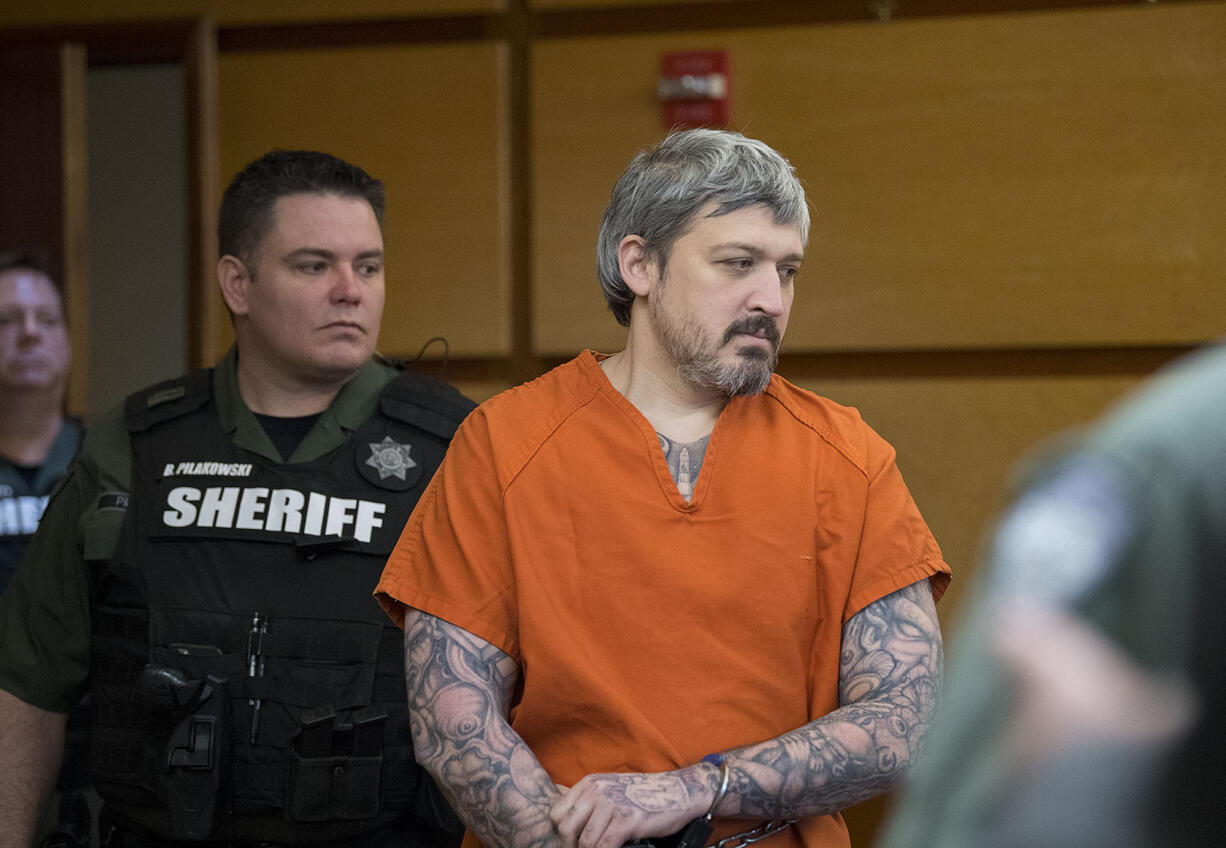 Brent Ward Luyster, who's accused in a Woodland triple-homicide in July and attempted jail escape in February, is escorted to arraignment March 6, 2017, in Clark County Superior Court. Luyster was back in court Monday morning for a review hearing, during which time his attorney requested co-counsel on the case.