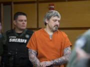 Brent Ward Luyster, who's accused in a Woodland triple-homicide in July and attempted jail escape in February, is escorted to arraignment March 6, 2017, in Clark County Superior Court. Luyster was back in court Monday morning for a review hearing, during which time his attorney requested co-counsel on the case.