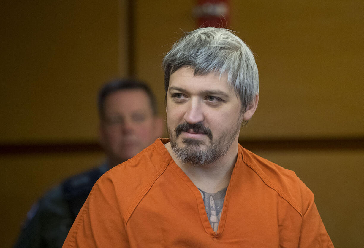 Brent Ward Luyster, the man accused in a Woodland triple-homicide over the summer and attempted jail escape last month, looks at people in the gallery during his arraignment Monday morning, March 6, 2017, in Clark County Superior Court.