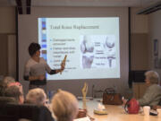 Wendi Walter, total joint program coordinator and licensed physical therapist assistant, leads a March 14 class on total-knee replacement surgery at Legacy Salmon Creek Medical Center. The hospital began in January offering a robotic-assisted version of the procedure using MAKOplasty technology. Surgeons have performed more than 15 of the procedures to date.