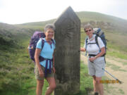 Nancy Herron and Sue Sayers pause at a way marker three days in to their walk on the El Camino Franc?s route of the El Camino de Santiago in 2014.