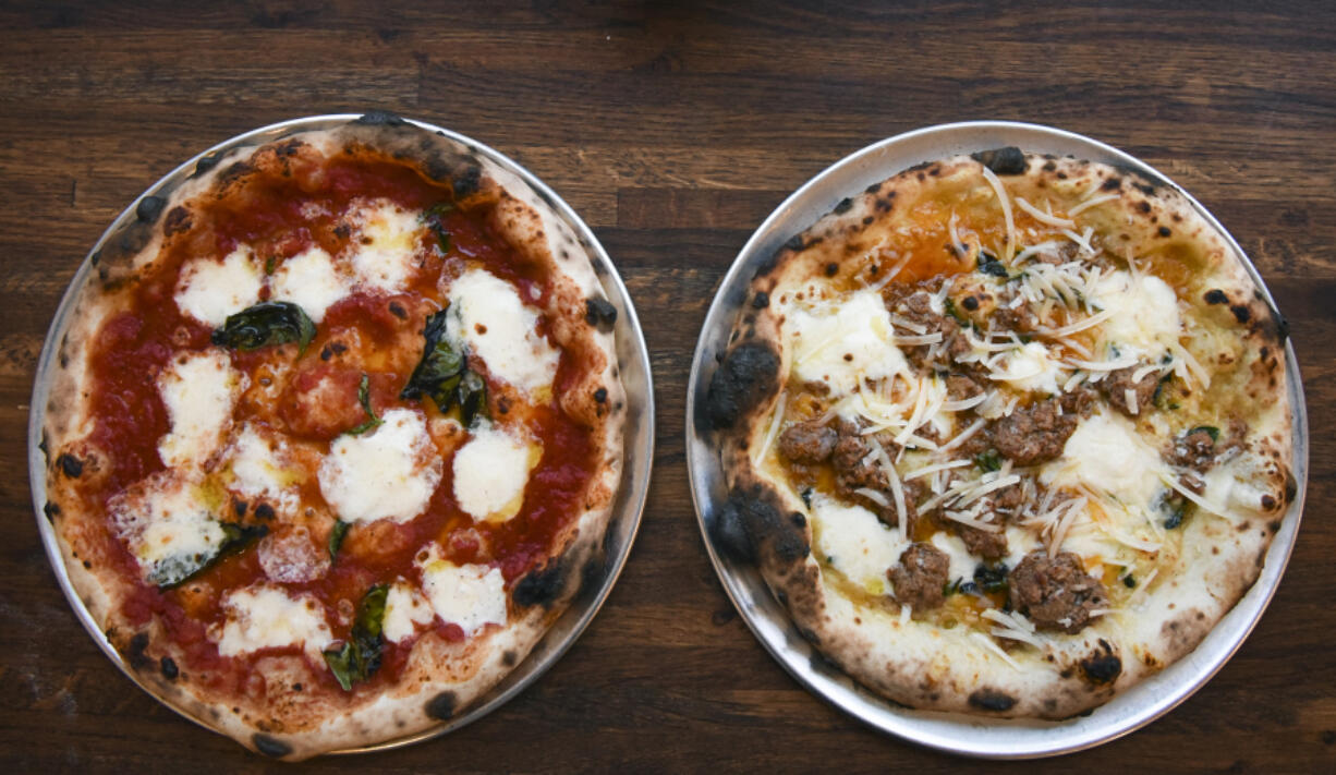 The Margherita pizza, left, and Bolognese pizza are seen at Nonavo Pizza in downtown Vancouver.