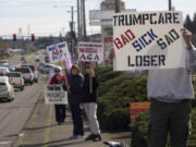 Alden Bice, who recently retired from a career in health care, joined other protesters across Clark County on Sunday who rallied to show support for the Affordable Care Act.