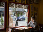 Don Griswold of Old Liberty Theater takes a call in Seasons Coffee Shop. He and his wife, Earleen Griswold, own the coffeeshop, and hope the Ilani Casino Resort opening in a few weeks just a few miles away will bring more people into Ridgefield.