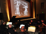 A small group of musicians from the Vancouver Symphony Orchestra, with Rodney Sauer on piano, accompany a silent comedy at the Kiggins Theatre in 2016.