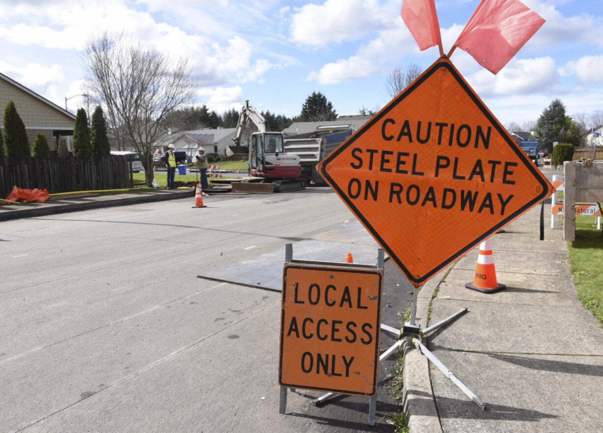 A NW Natural crew works to move gas lines on Southwest 18th Street in Battle Ground. The crew is moving the gas line to make way for new utility lines going underneath South Parkway Avenue as part of the city&#039;s $5.6 million South Parkway Improvement Project.