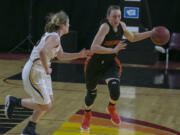 Washougal's Beyonce Bea (5), accelerates past Burlington-Edison's Delaney Watson (35), during the second round of the WIAA 2A girls state tournament on Thursday, Mar. 2, 2017, at the Yakima Valley SunDome. The Burlington-Edison Tigers defeated the Washougal Panthers 58-55.