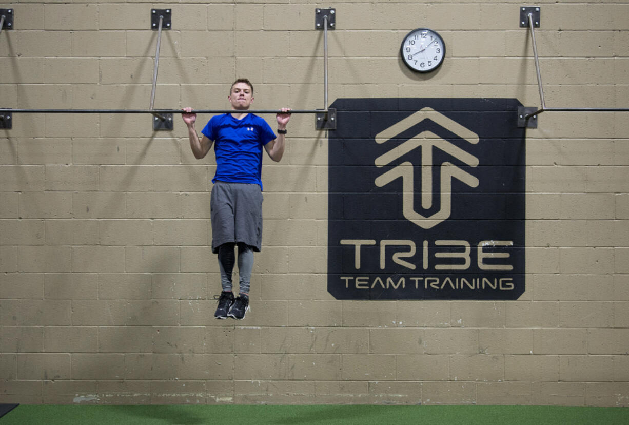 Ben Spinney of Vancouver works out at Cascade Athletic Club in Vancouver. Spinney, 21, was preparing to appear on the obstacle-course competition series &quot;American Ninja Warrior,&quot; but learned last week that his heart condition would prohibit him from competing.