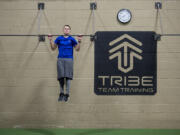 Ben Spinney of Vancouver works out at Cascade Athletic Club in Vancouver. Spinney, 21, was preparing to appear on the obstacle-course competition series &quot;American Ninja Warrior,&quot; but learned last week that his heart condition would prohibit him from competing.