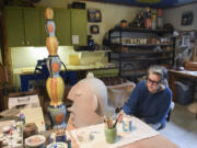 Artist Kim Murton&#039;s approach to ceramics draws heavily on her background in illustration and animation. She worked on this big head while chatting with The Columbian on Tuesday morning.