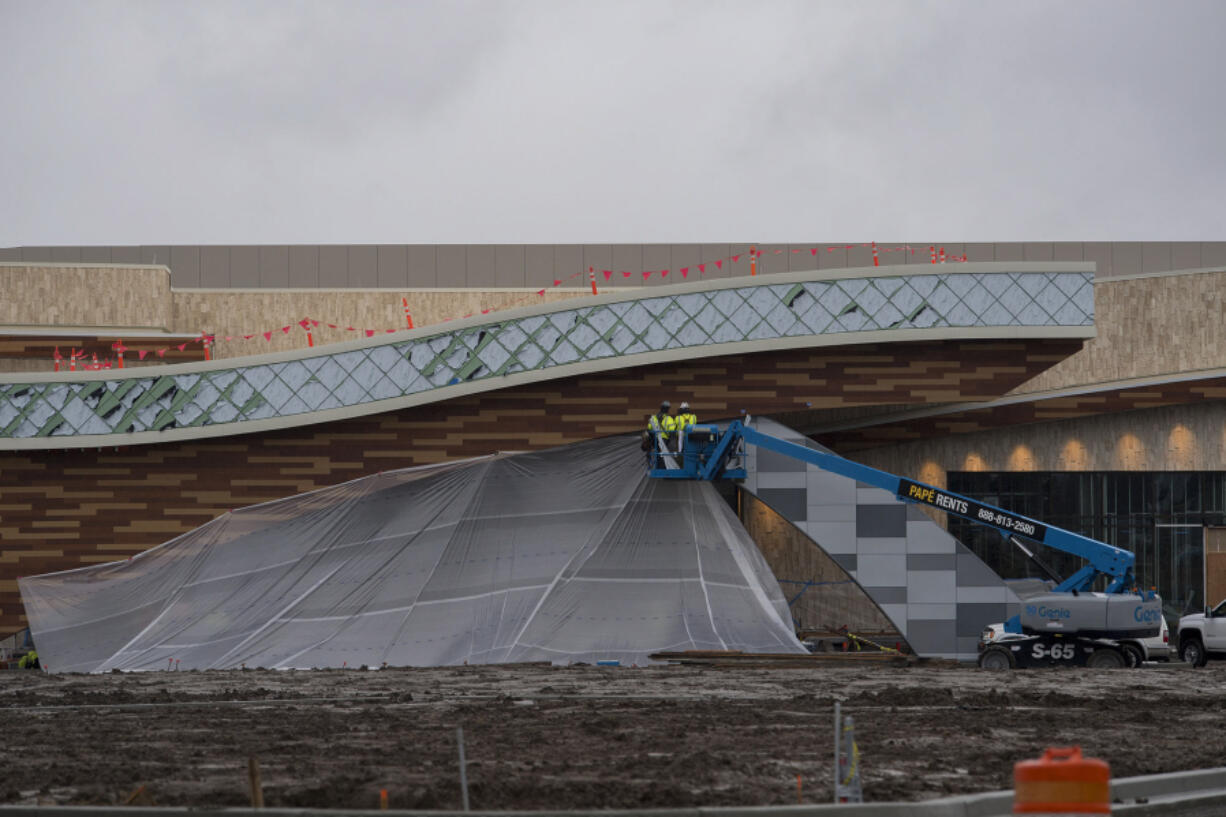 Construction crews work on the Ilani Casino Resort vestibule weeks before its mid-April opening. An opening day has not been announced, but casino officials say they are on schedule.