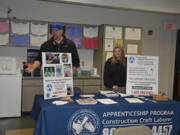 Washougal: Deken Letinich, field representative from the Washington and Northern Idaho District Council of Laborers, mans a booth at Washougal High School&#039;s Post High School Career Options Fair on Feb.