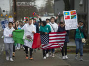 Vancouver students show their support for minority and immigrant students as they march along East Fourth Plain Boulevard on Monday afternoon. In an organized walkout, more than 100 students left class to protest the Trump administration&#039;s policies on immigration and to call on Vancouver Public Schools to issue a letter saying students are safe on campus.