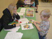 Washougal: Kayla and Tanner Woods at Hathaway Elementary School&#039;s Family Math Night, where students and their families solved puzzles, built clocks and competed in multiplication contests.