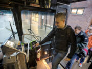 Vancouver resident and electronic fare beta tester Nate Silva swipes his Hop Fastpass as he boards the bus at the Fisher&#039;s Landing Transit Center Monday morning. Silva was one of the first 250 people in the metro area selected to test the new payment system.