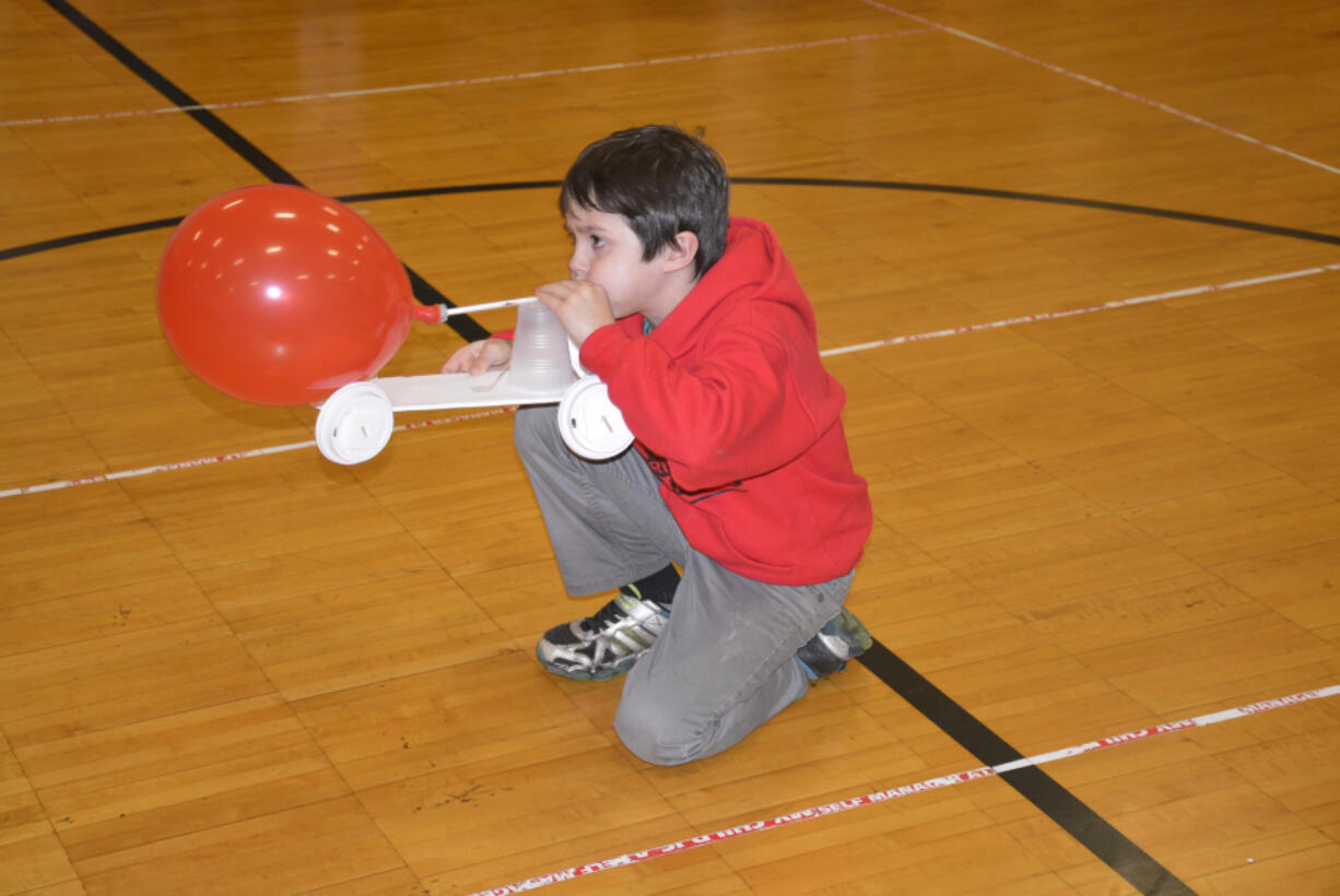 Washougal: Cape Horn-Skye Elementary School fourth-grader Wyatt Compher using a balloon-powered car during the school&#039;s annual Science Night on March 9.