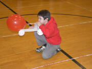 Washougal: Cape Horn-Skye Elementary School fourth-grader Wyatt Compher using a balloon-powered car during the school&#039;s annual Science Night on March 9.