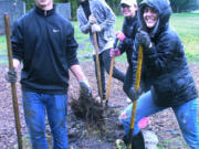 Hazel Dell: Forty-four Food and Your Health students from Clark College, including Arnold Vasquez, from left, Juan Carlos, Maia Kment and Faith Wirchak helped get the Hazel Dell School and Community Garden ready for the spring during work parties held earlier this month.