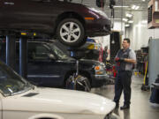 Automotive technician Dale Svendsen changes a car&#039;s oil at Gaynors Automotive in Salmon Creek. Gaynors is one of several automotive shops participating in Don&#039;t Drip and Drive, a regional campaign aimed at keeping vehicle fluids out of the environment.