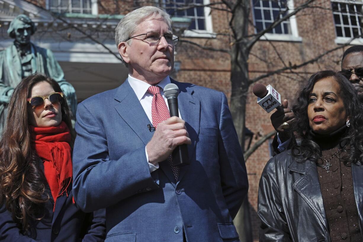 Charles Taney III, a descendant of U.S. Supreme Court Chief Justice Roger Taney, center, offers apology to Lynne Jackson, a descendant of Dred Scott, right, on the 160th anniversary of the Dred Scott decision in front of the Maryland State House, Monday, March 6, 2017, in Annapolis, Md. On March 6, 1857, the U.S. Supreme Court, in Dred Scott v. Sandford, ruled 7-2 that Scott, a slave, was not an American citizen and therefore could not sue for his freedom in federal court. (Kenneth K.