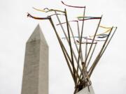 A group protesting the Dakota Access oil pipeline has set up teepees on the National Mall near the Washington Monument in Washington, Tuesday, March 7, 2017. A federal judge declined to temporarily stop construction of the final section of the disputed Dakota Access oil pipeline, clearing the way for oil to flow as soon as next week.