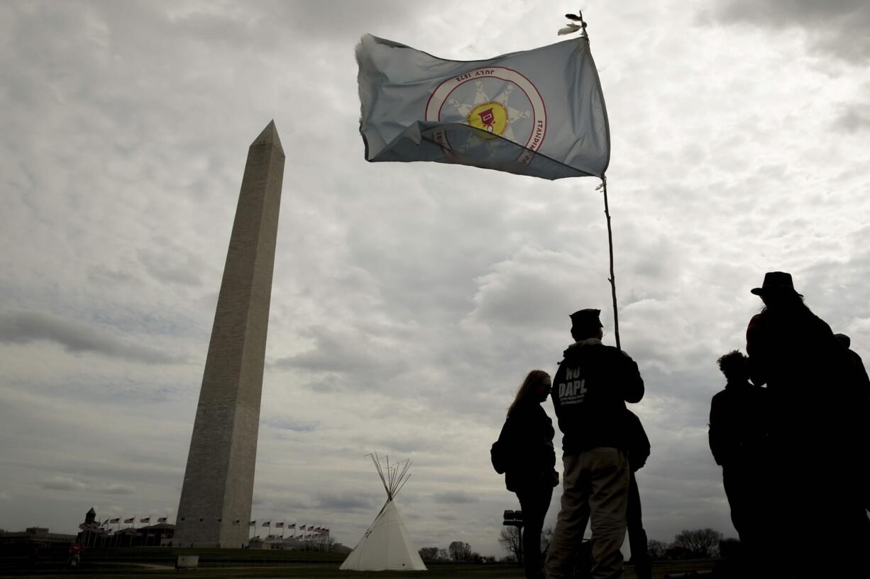 A group protesting the Dakota Access oil pipeline has set up teepees on the National Mall near the Washington Monument in Washington, Tuesday, March 7, 2017. A federal judge declined to temporarily stop construction of the final section of the disputed Dakota Access oil pipeline, clearing the way for oil to flow as soon as next week.