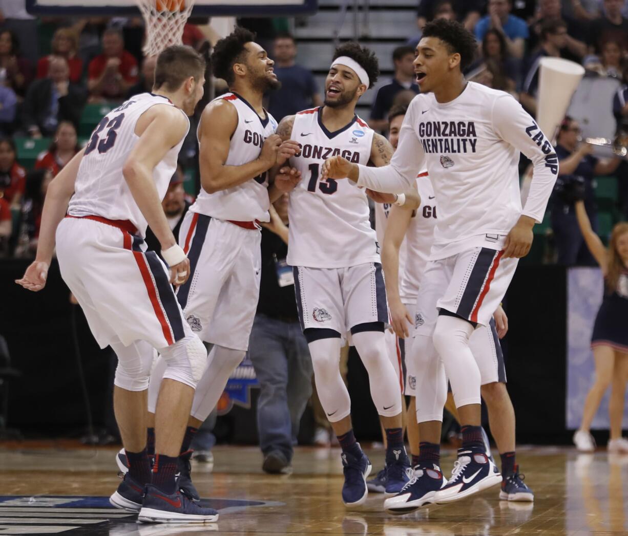 Gonzaga players celebrate after beating Northwestern during the second half of a second-round college basketball game in the men's NCAA Tournament, Saturday, March 18, 2017, in Salt Lake City.