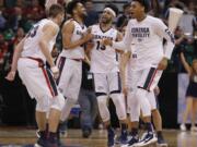 Gonzaga players celebrate after beating Northwestern during the second half of a second-round college basketball game in the men's NCAA Tournament, Saturday, March 18, 2017, in Salt Lake City.