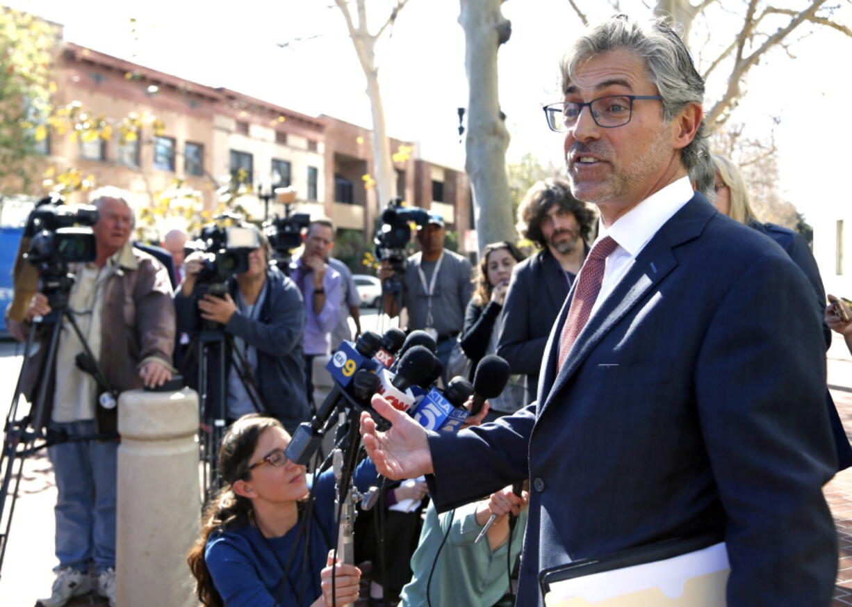 Attorney Robert Blume speaks to reporters outside federal court in Santa Ana, Calif., on Monday.