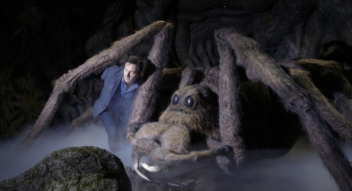 Actor Jason Isaacs poses for the media Wednesday next to Aragog the Acromantula at a new extension called the &quot;Forbidden Forest&quot; to the Warner Brothers studio tour &quot;The Making of Harry Potter&quot; in Watford, England. Isaacs played Lucius Malfoy in the popular Harry Potter films.