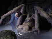 Actor Jason Isaacs poses for the media Wednesday next to Aragog the Acromantula at a new extension called the &quot;Forbidden Forest&quot; to the Warner Brothers studio tour &quot;The Making of Harry Potter&quot; in Watford, England. Isaacs played Lucius Malfoy in the popular Harry Potter films.